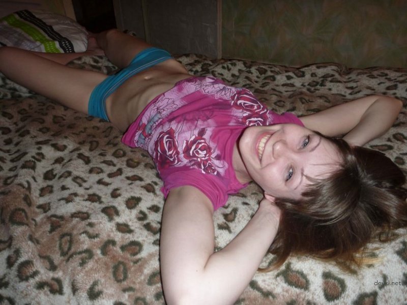 Young babe takes off panties: Explicit amateur photo