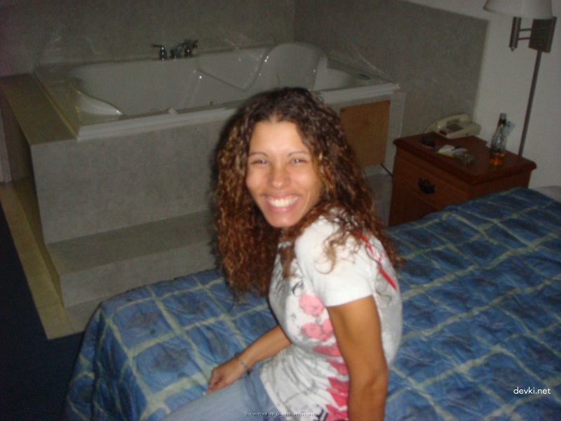 Curly-haired Babe Loves Giving Blowjob - Explicit Oral Sex Photo