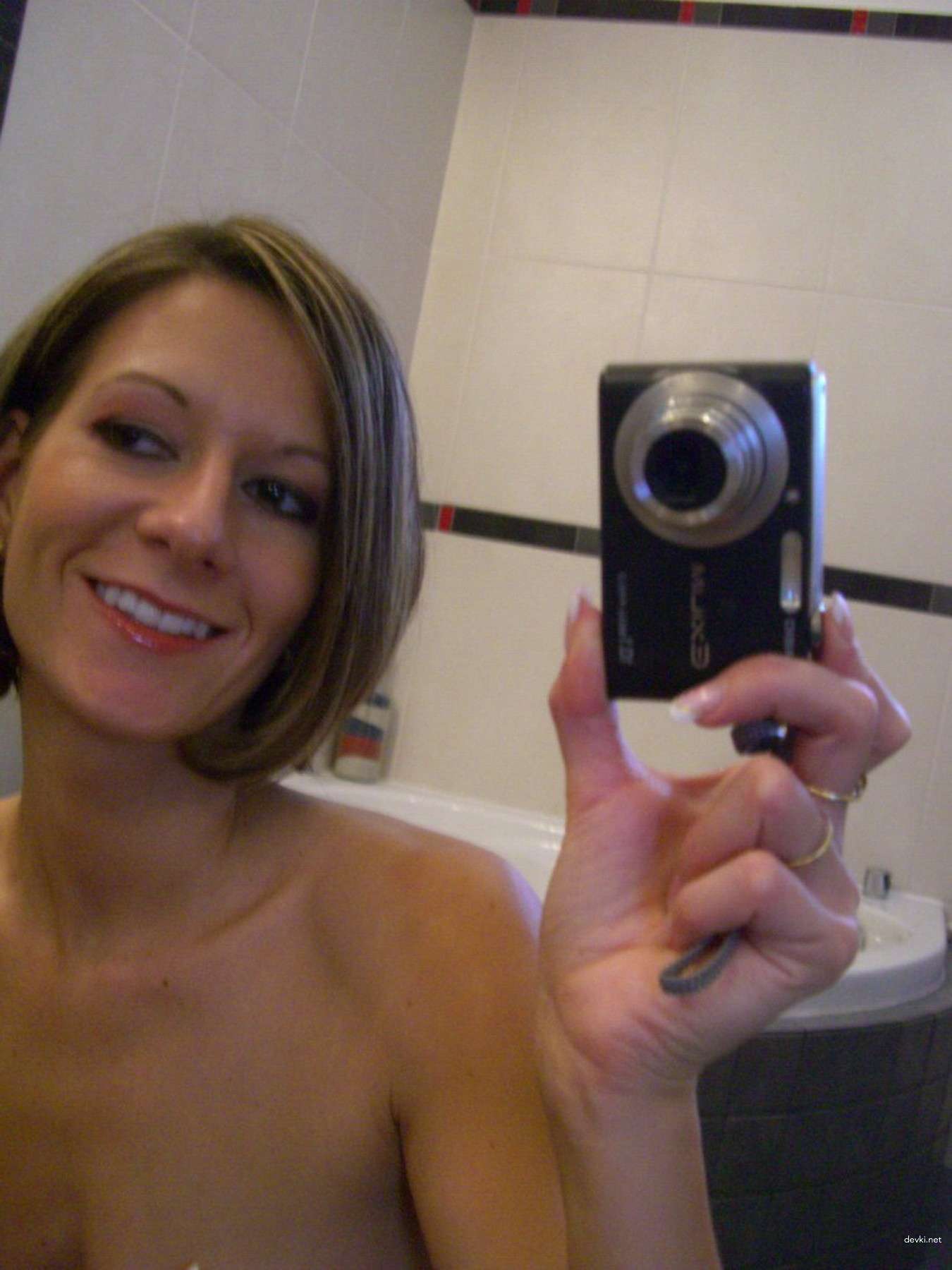 Private Selfie of Slim Woman: Explicit Amateur Photo with Boldness and Sensuality