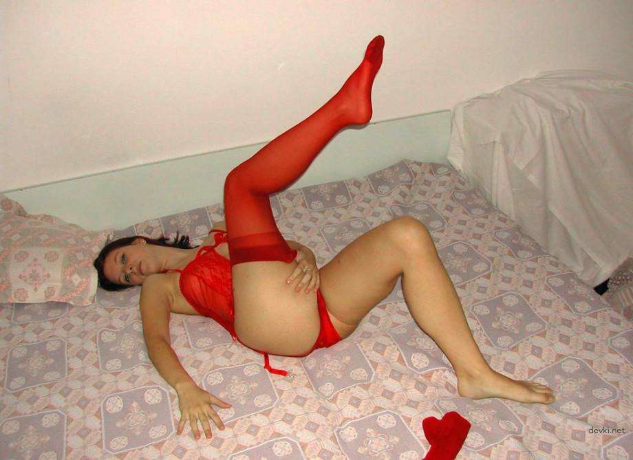 Stretching pussy with huge dildo in explicit porn photo