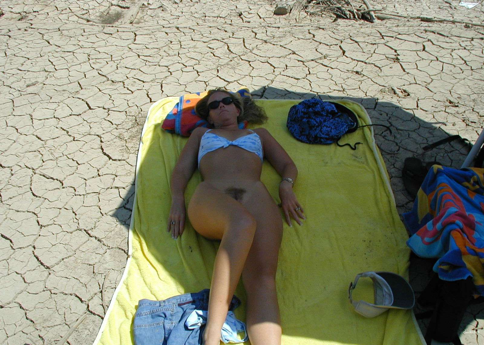 Naked Woman Sunbathing on Beach - Explicit Nude Beach Porn Photo