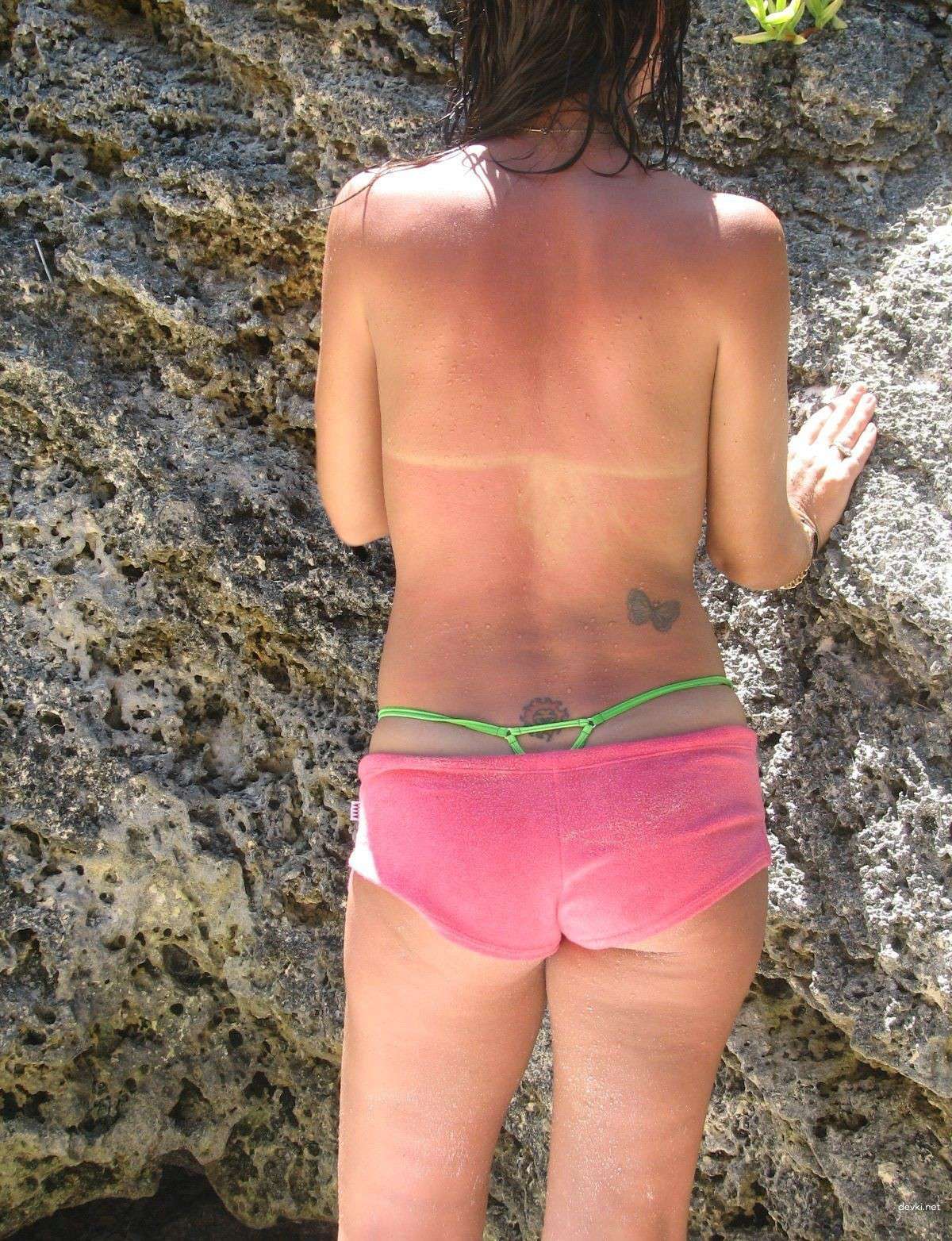 Brunette's Explicit Beach Photo Diary: Uncensored Shots from the Sea.