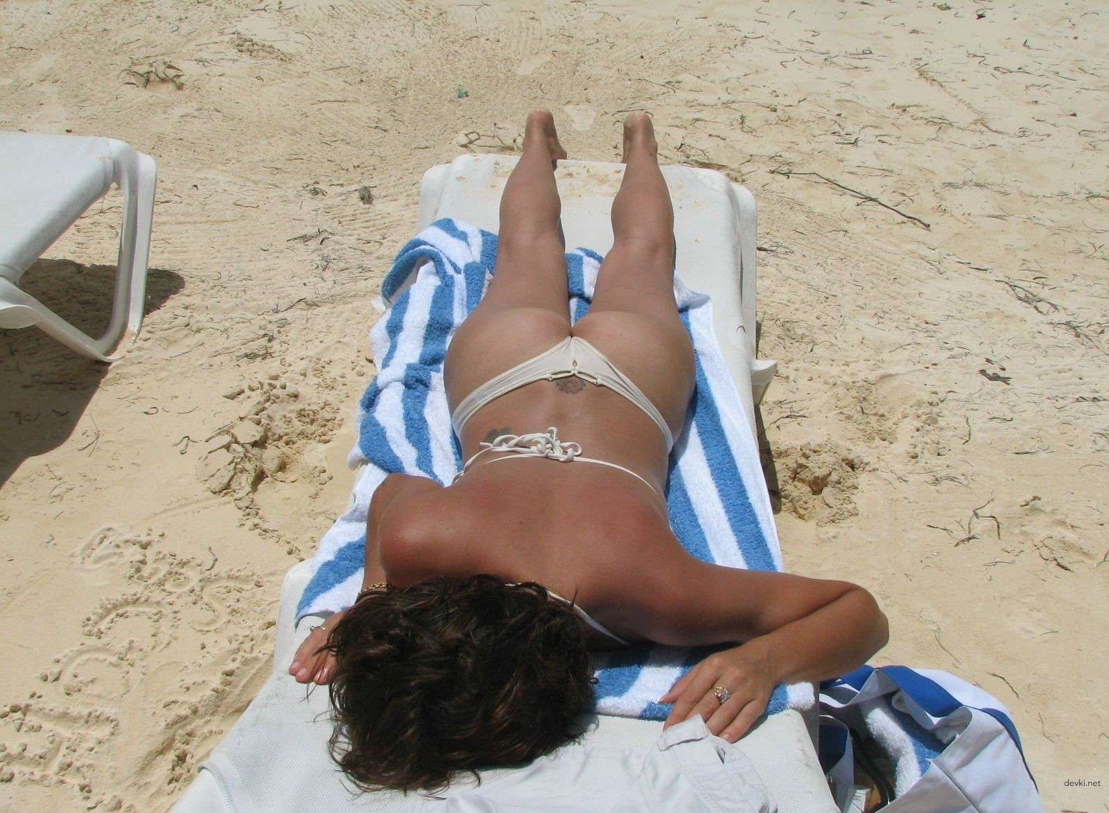 Brunette's Explicit Beach Photo Diary: Uncensored Shots from the Sea.