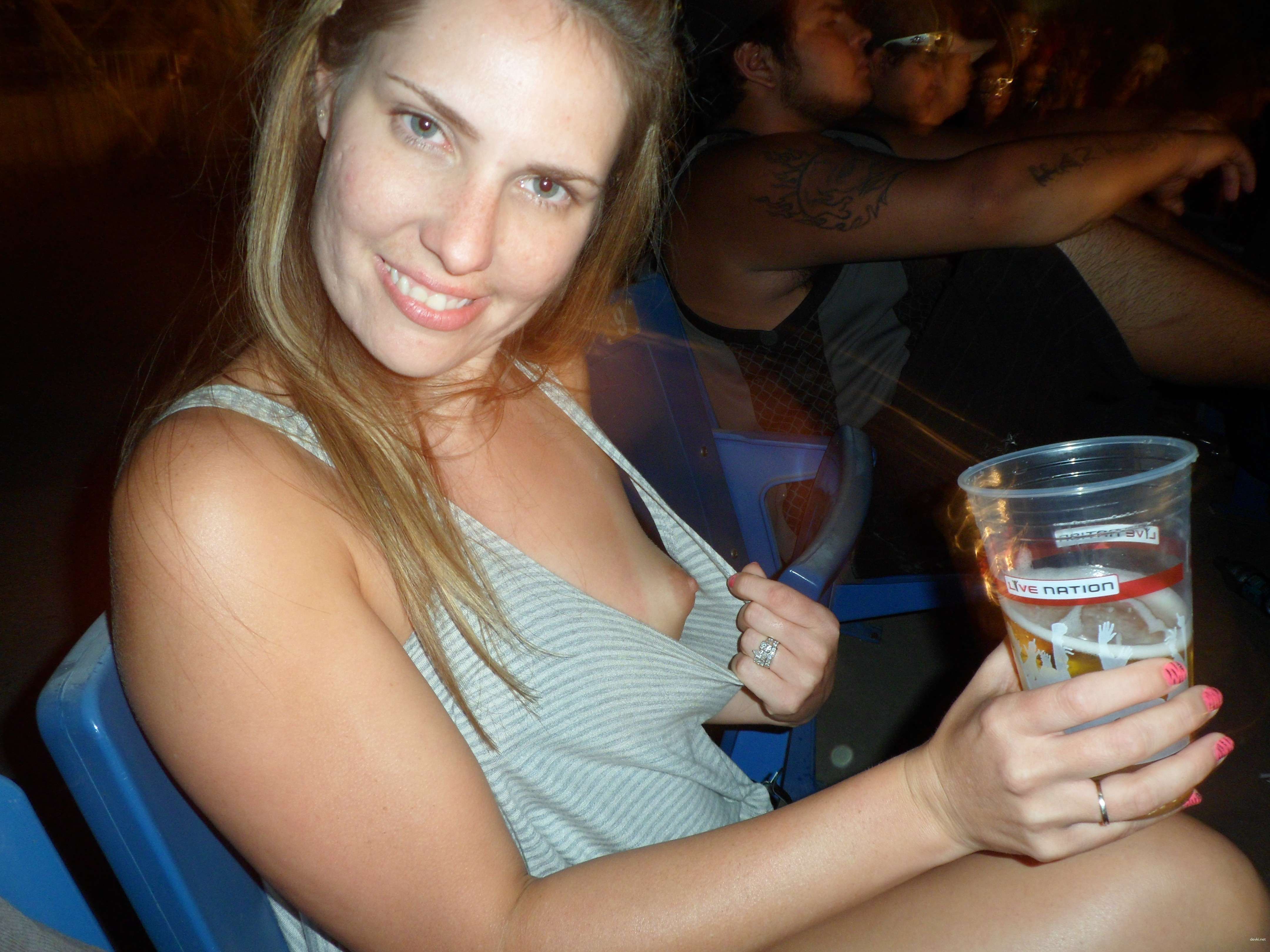 Public Flashing: Busty Girl Shows Off Her Assets in the City
