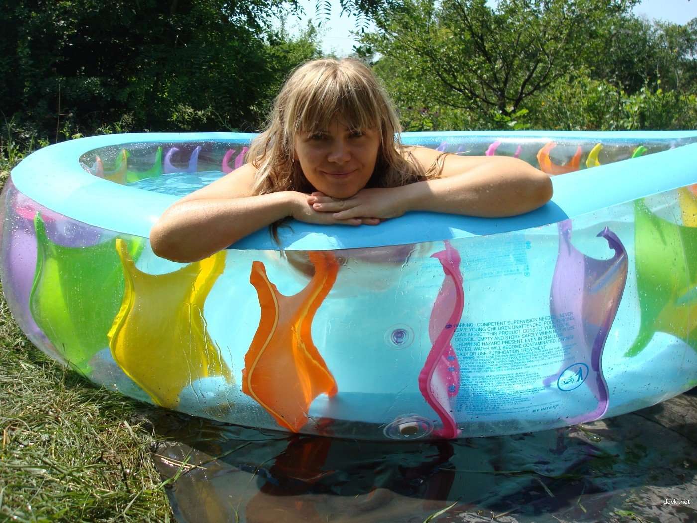 Naked Girl in Inflatable Pool: Explicit Amateur Photo Shoot