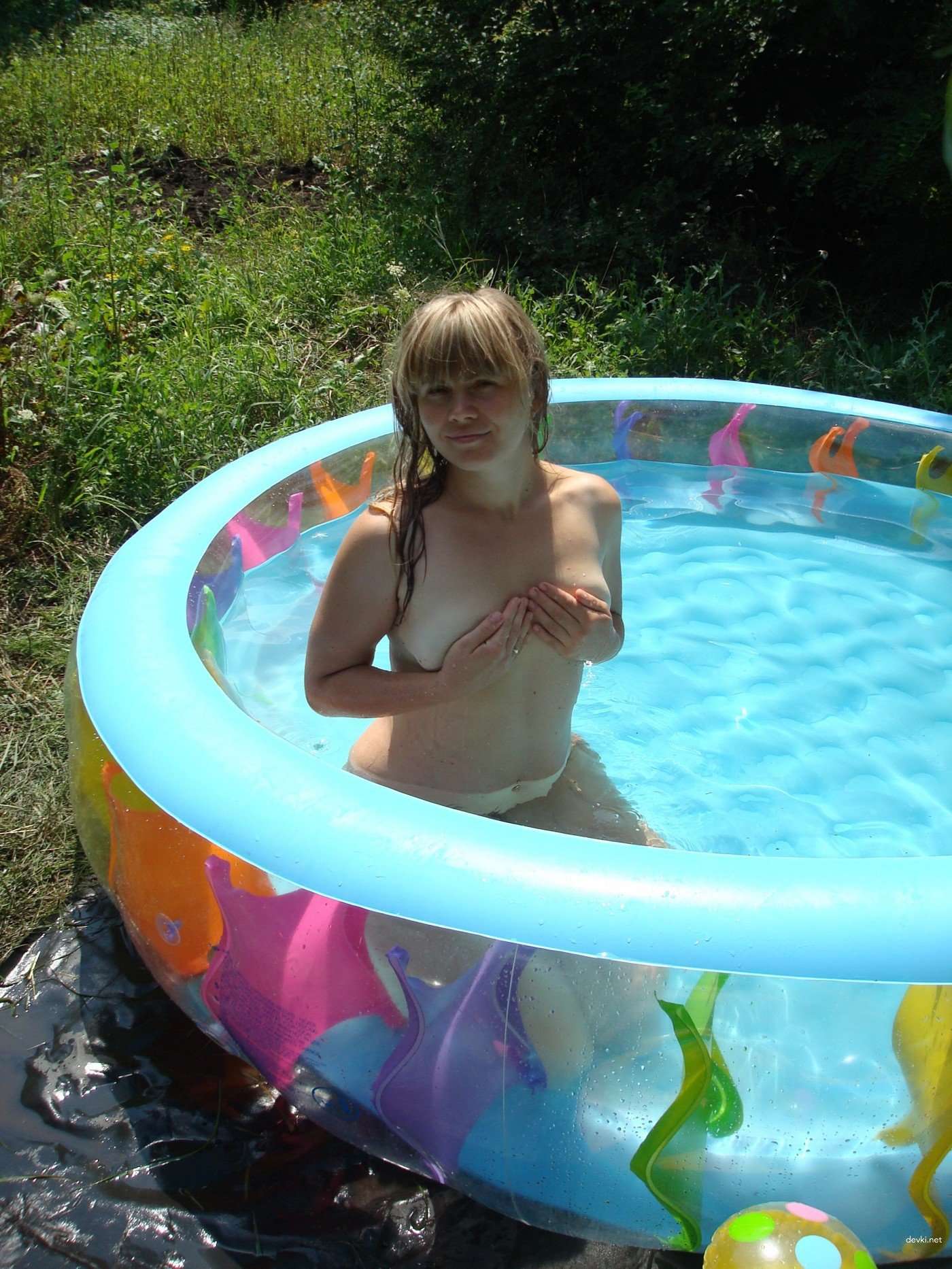 Naked Girl in Inflatable Pool: Explicit Amateur Photo Shoot