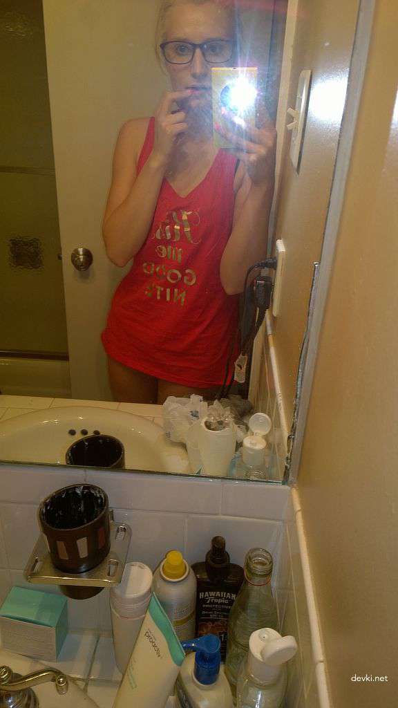 Explicit Amateur Selfie: Intimate Bedroom Photo Shoot with Seductive Poses