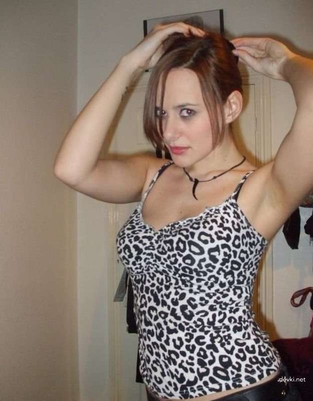 Amateur Babe Strips Erotically on Camera for Explicit Photoshoot