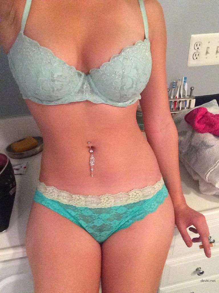 Explicit Amateur Photos: Girl with Shaved Pussy Exposing Herself at Home