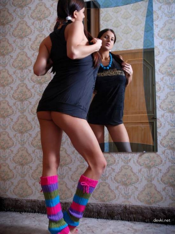 Sultry Brunette with Braids Poses Explicitly at Home