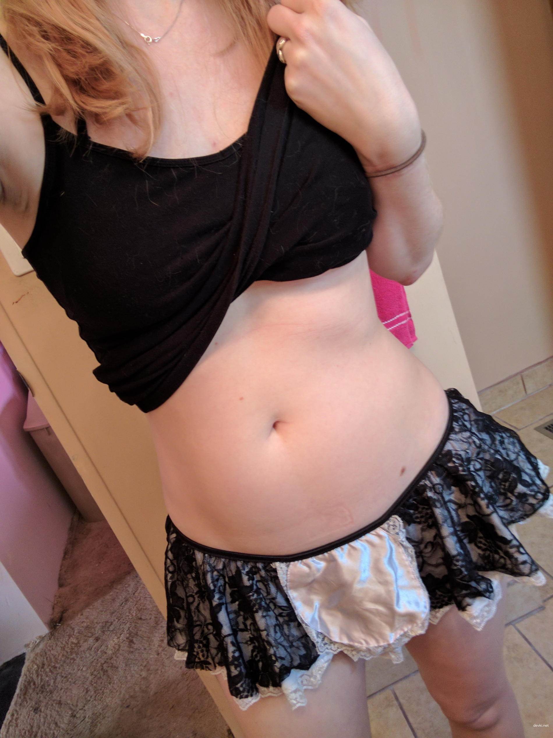 Girl undresses and plays with dildo in her pussy