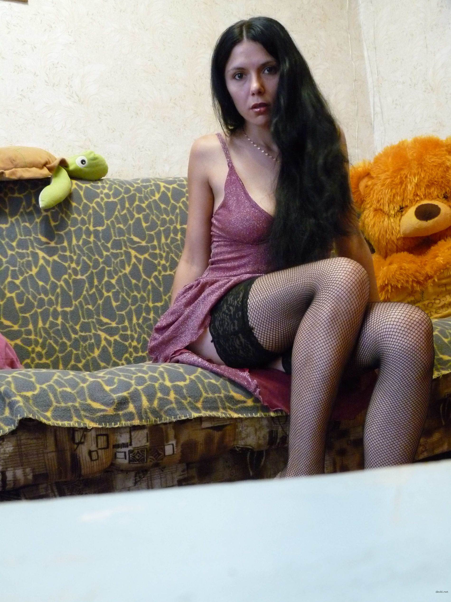 Explicit Amateur Photo of Young Brunette - Sensual Pose and Seductive Gaze