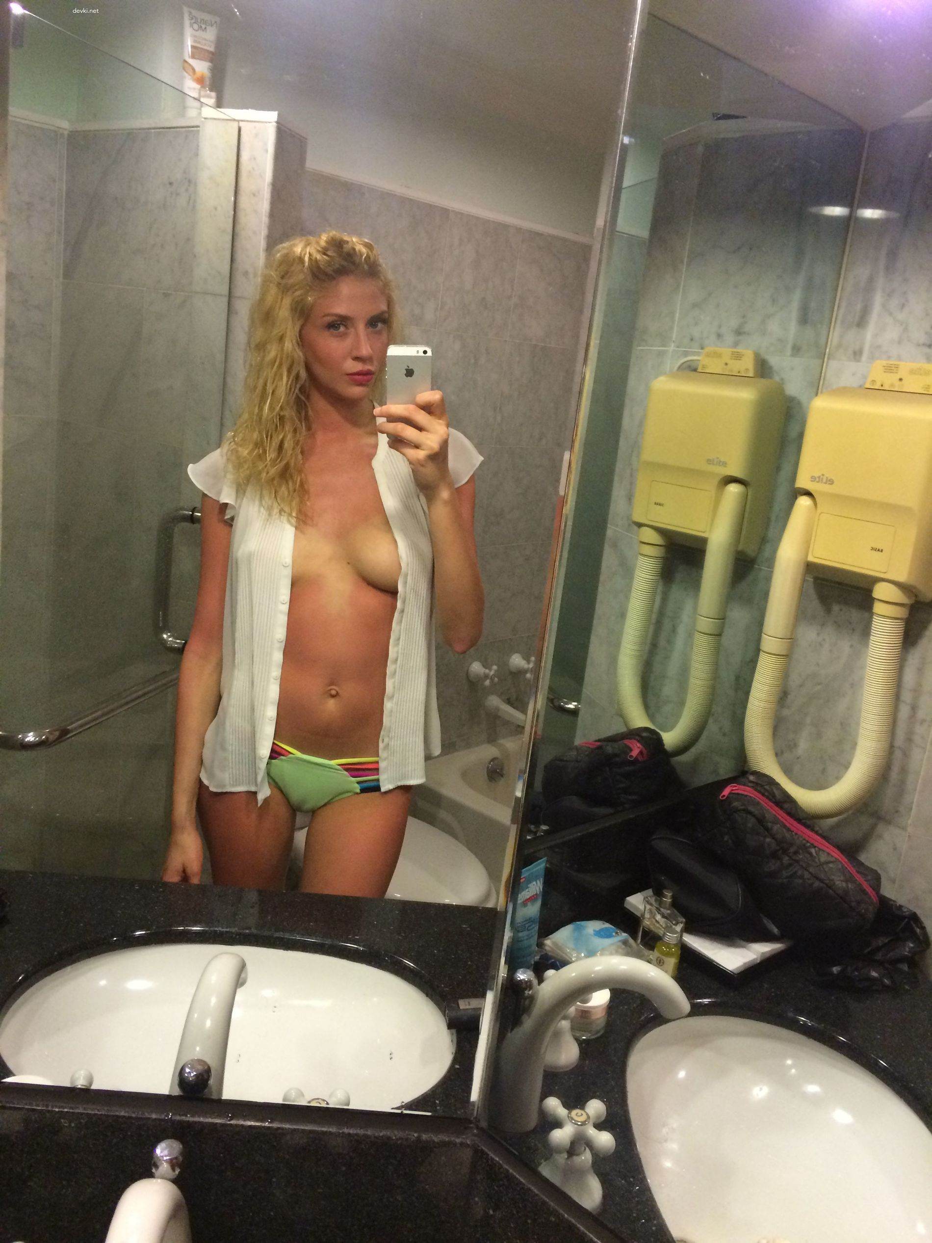 Amateur Blonde Captures Her Naked Breasts in Explicit Photo Shoot