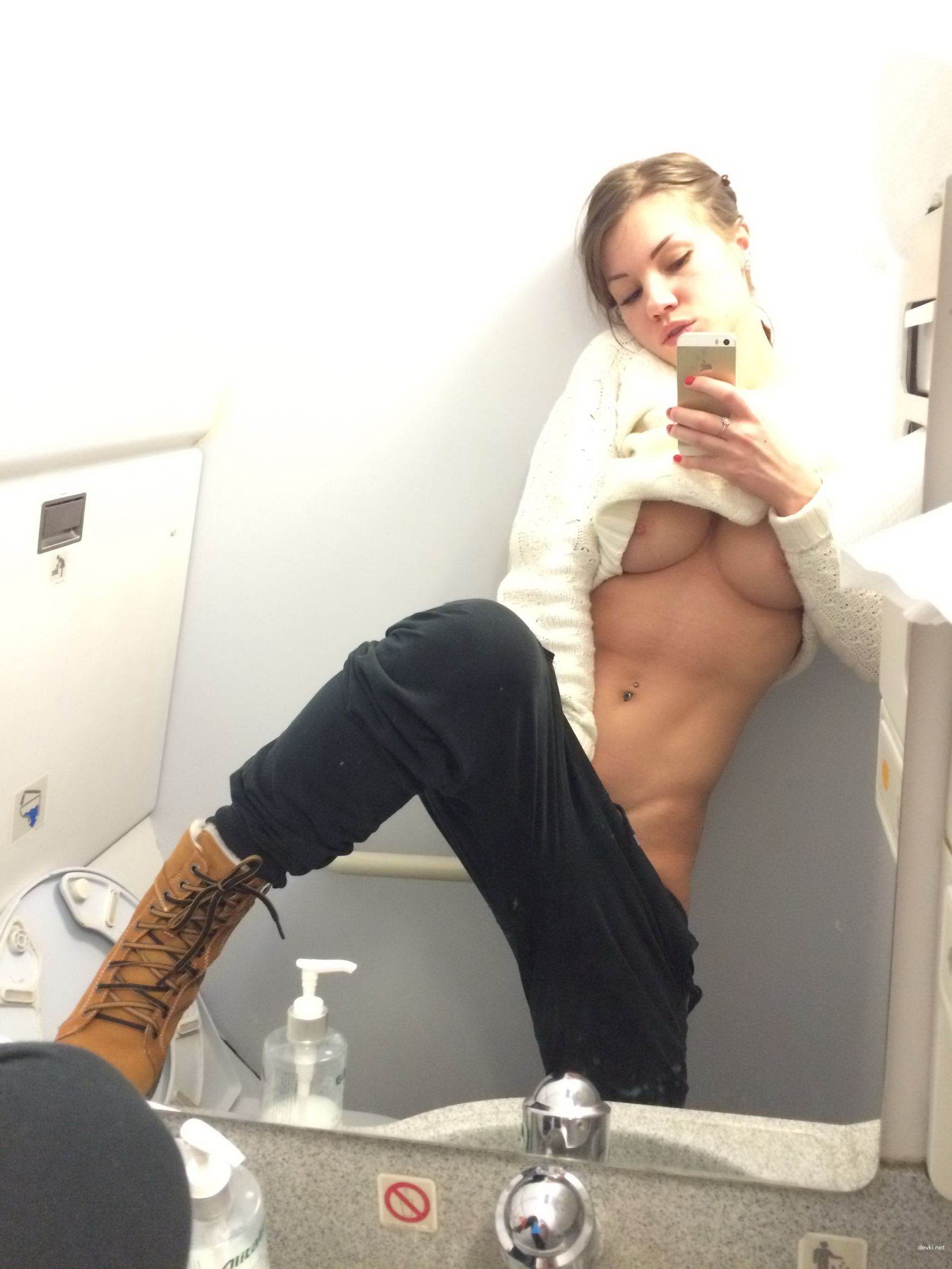 Sultry Selfie of a Babe in an Airplane - Explicit Amateur Photo