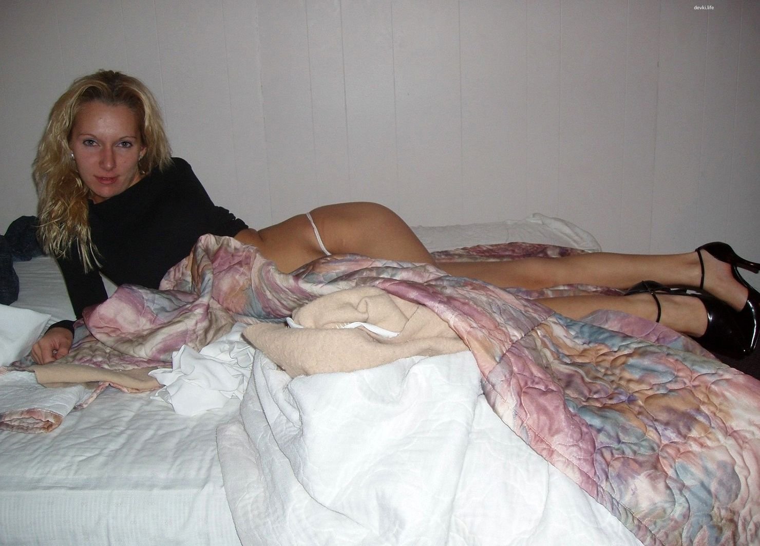 Blonde Amateur Poses Explicitly in Bed - Hot and Provocative Shot