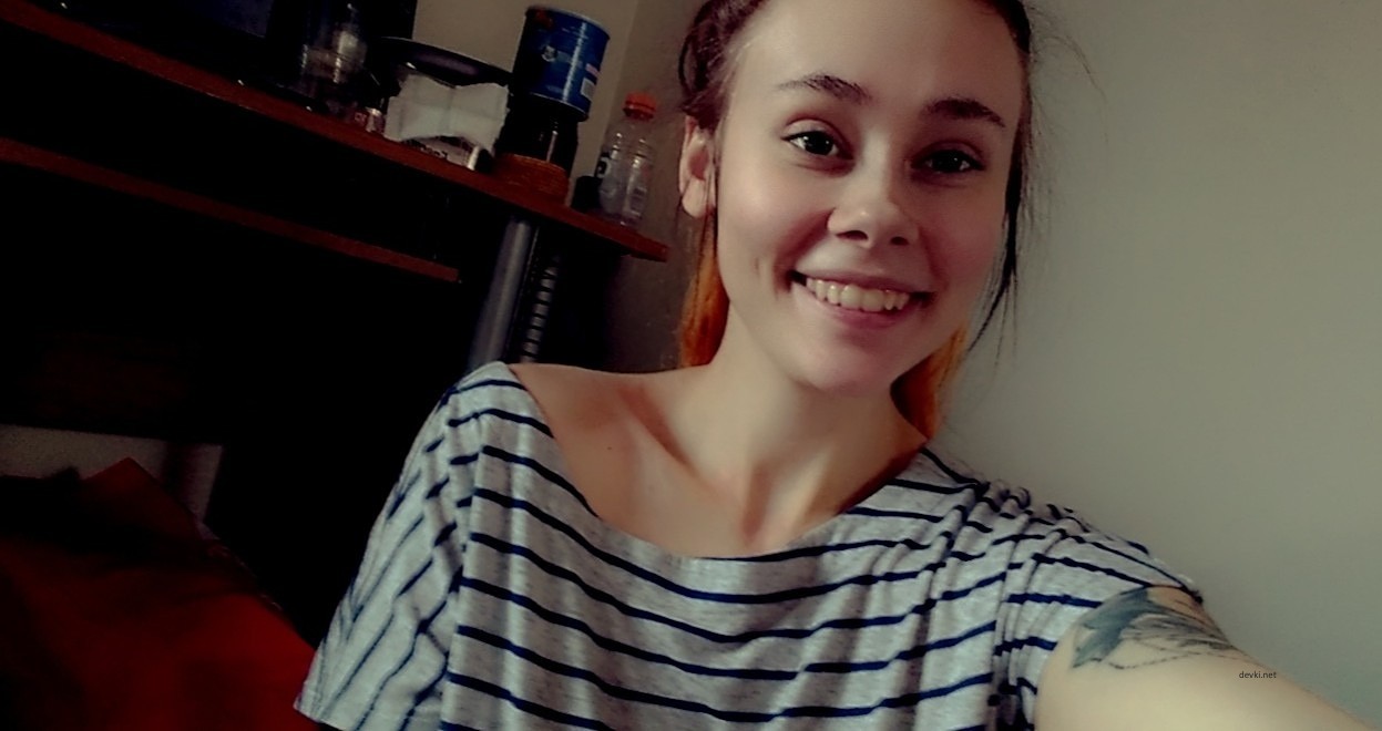 Voluptuous Smile: Busty Amateur Beauty Exposing Assets in Provocative Pose