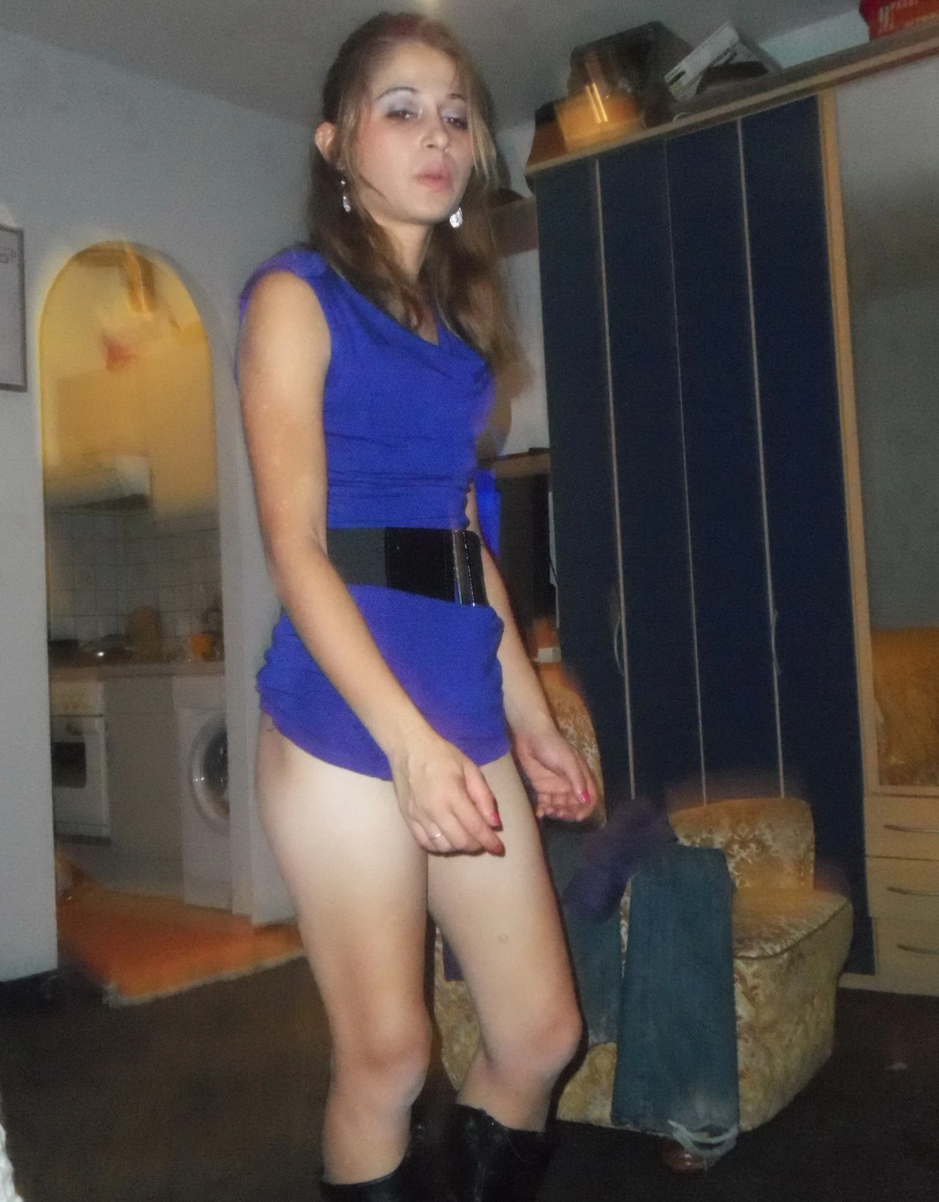Girl strips off pantyhose and panties in front of guy - Explicit amateur porn photo.