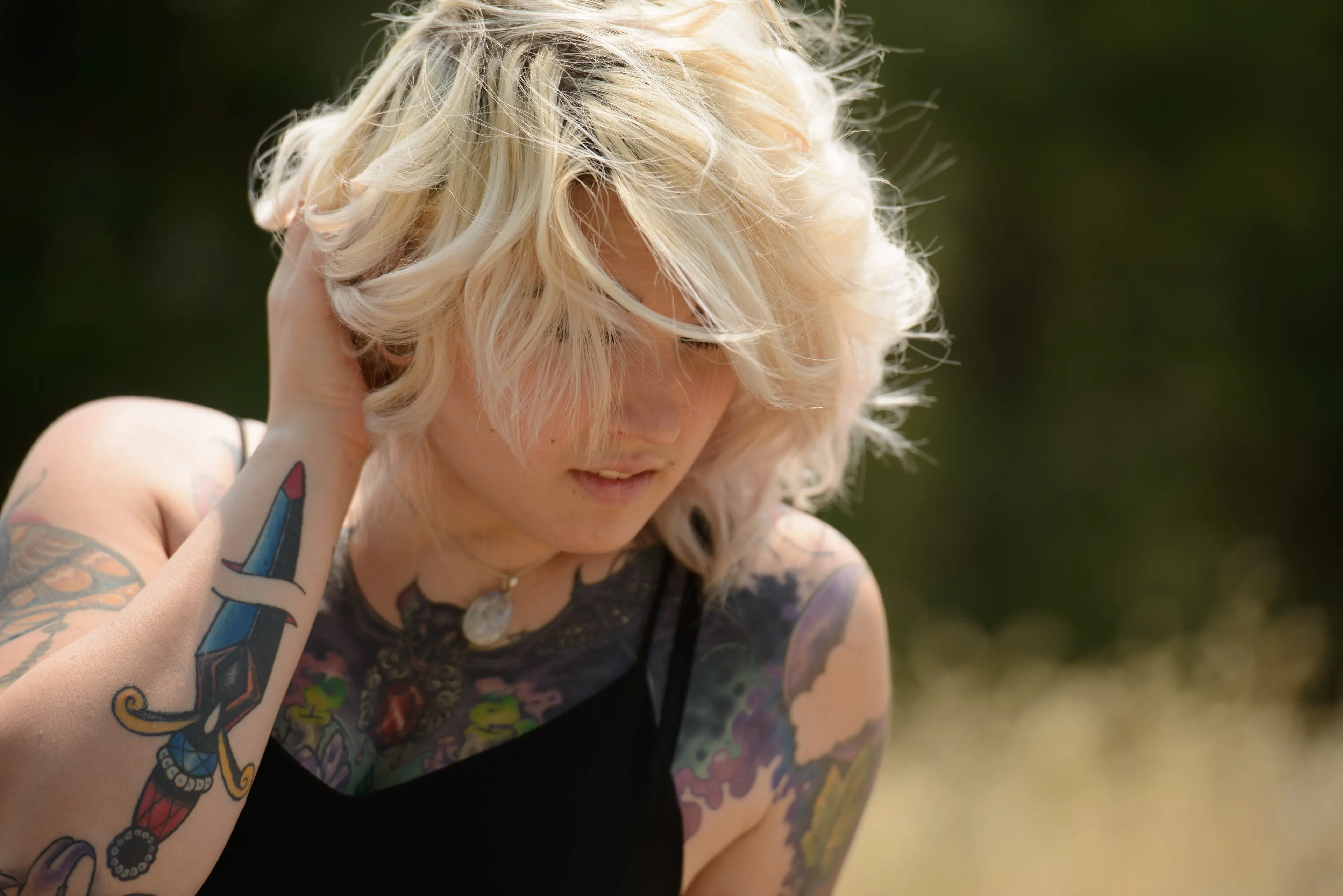 Blonde Shows Off Naked Body and Tattoos in Amateur Photo Shoot