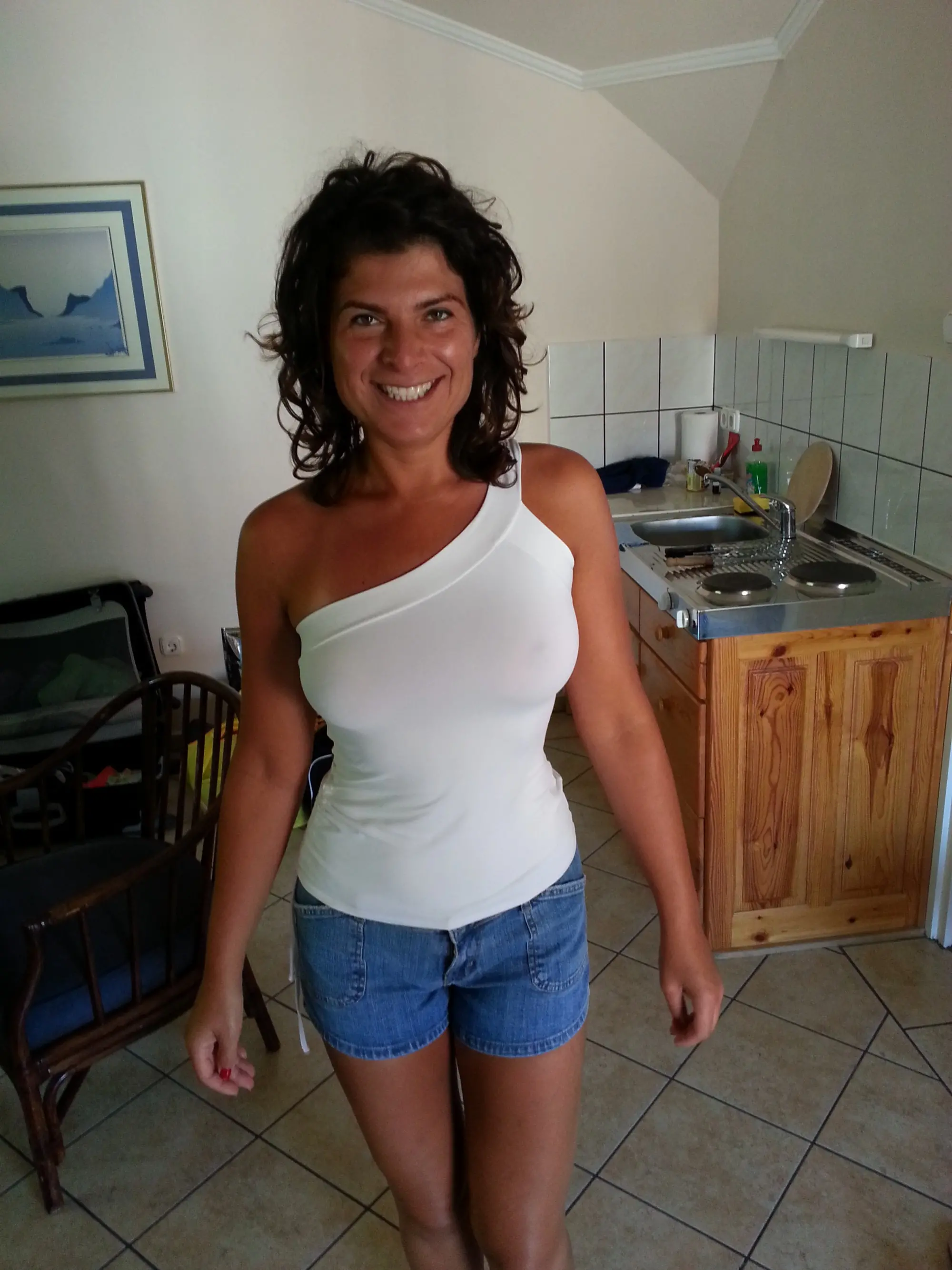 Mature Woman Shows Off Sexy Tan on Nude Body: Amateur Explicit Photo