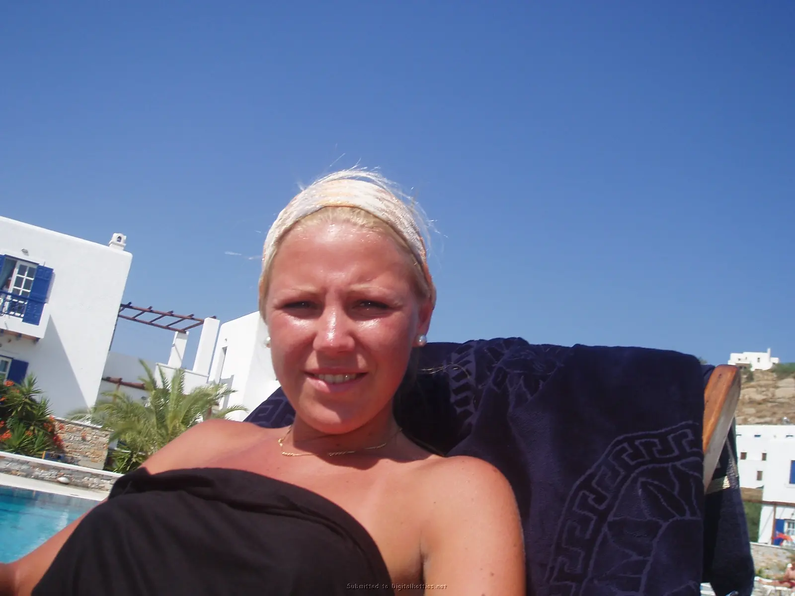 Blonde Exposes Tanned Boobs: Amateur Topless Photo Shoot