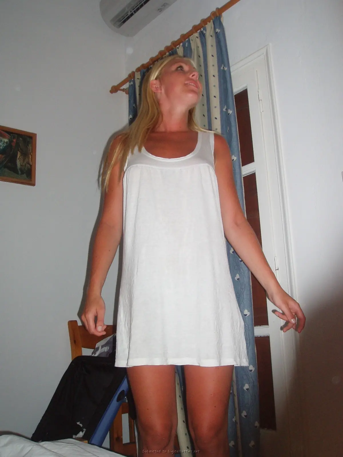 Blonde Exposes Tanned Boobs: Amateur Topless Photo Shoot