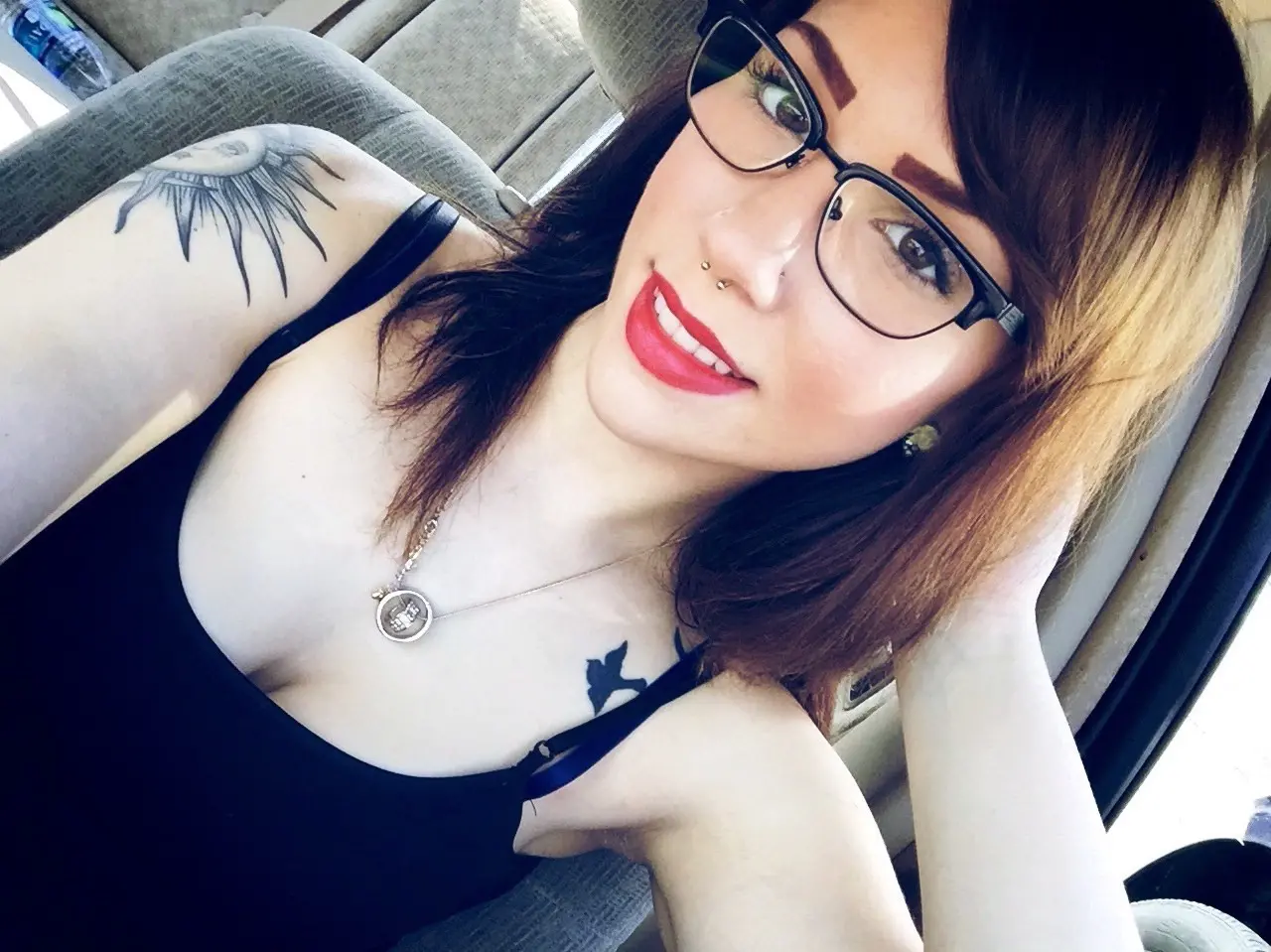 Seductive Girl in Glasses Tempts with Smile - Amateur Explicit Photo